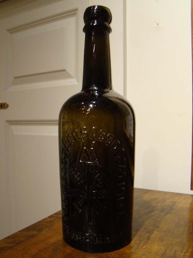 A late 19th century "York Bottlers Association Ltd" embossed black glass bottle
